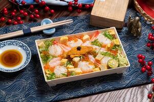 Sweet Shrimp Sea Urchin Scallop Don in a dish with chopsticks isolated on mat side view on wooden table taiwan food photo