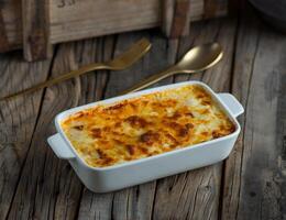 beef lasagna pasta served in a dish isolated on wooden background side view of pasta photo