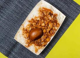 Braised Rice with Pork and Soy Sauce served in bowl isolated on table top view of taiwan food photo