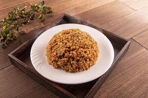 Fried rice with soy sauce served dish isolated on wooden table top view of Hong Kong food photo