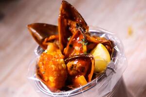 Seashell Bucket specials served isolated on background top view food photo