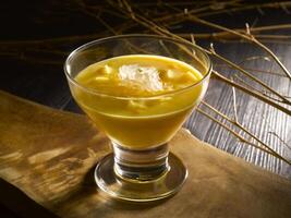 Chilled Mango Puree with Sago and Pomelo served in dish isolated on table top view of food photo