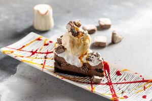 Mud Pie cake with ice cream served in dish isolated on table top view of arabic breakfast photo