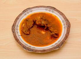 Delhi chicken korma served in dish isolated on table top view indian spicy food photo