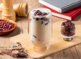 Wantan Red Bean Thick Soy Milk served in glass isolated on table top view of asian food photo