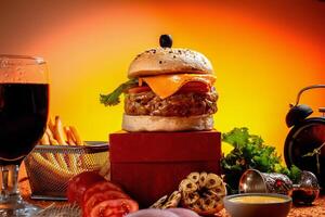 Tongue Twister Beef Naga burger with fries and tomato slice isolated on wooden board side view of american street food photo