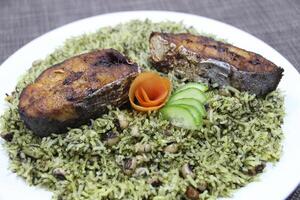 grilled King Fish rice served in a dish isolated on wooden background side view photo