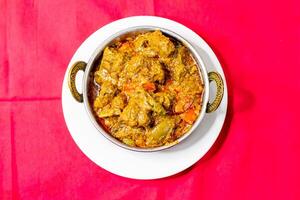 mutton karahi, Indian Lamb Curry, mutton bhuna masala served in karahi top view of pakistani food photo