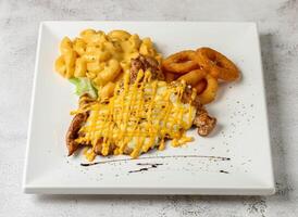 double cheese grill chicken with mac and cheese served in dish isolated grey background top view singapore fast food photo