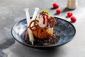 Fried Cheesecake with ice cream, chocolate chip and berries served in dish isolated on table top view of arabic breakfast photo