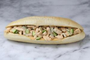 Smoked Chicken Salad Sandwich isolated on grey background side view of fastfood photo