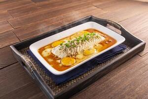 bridge tofu with egg served dish isolated on wooden table top view of Hong Kong food photo
