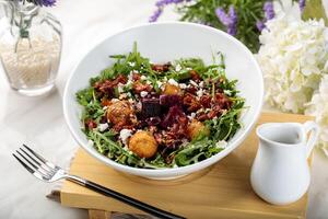 ADORABLE fresh salad served in a dish isolated on table side view of arabian salad healthy food photo