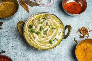 Chicken Reshmi Butter Masala karahi served in a dish isolated on grey background top view of bangladesh food photo