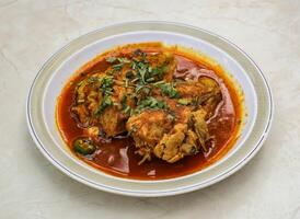 served in plate isolated on table top view of indian and pakistani spicy food photo