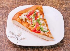 italian food bread pizza slice isolated on dark wooden background top view photo