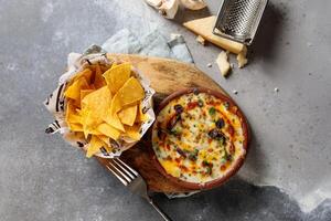 Original Gratin with snacks served in dish isolated on table top view of arabic breakfast photo