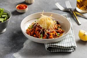 Bahrani Macaroni with lime and chilli sauce served in dish isolated on table top view of arabic breakfast photo