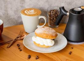 Danish Apple with Mocha latte coffee beans, fork, spoon served in dish isolated on wooden table top view of taiwan food photo