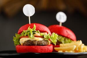 Mini Beef Burger with fries served in a dish isolated on grey background side view fast food photo