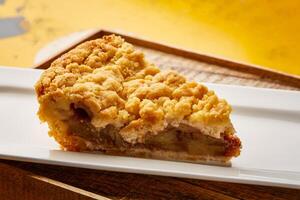 Arab Apple Pie Slice served in dish isolated on wooden table top view of arabic sweet dessert photo