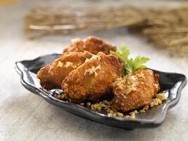 Crispy Chicken Mid Joint wings with Prawn Paste served dish isolated on background top view food photo