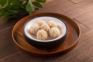 Snowflake Glutinous Rice Steamed Meatballs served dish isolated on wooden table top view of Hong Kong food photo