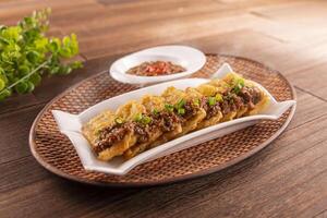 Golden Eggplant with Minced Meat and garlic sauce served dish isolated on wooden table top view of Hong Kong food photo