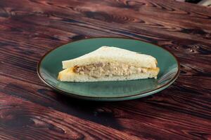 Fresh club sandwich filled with chicken and mayo dip isolated on table top view of indian food photo