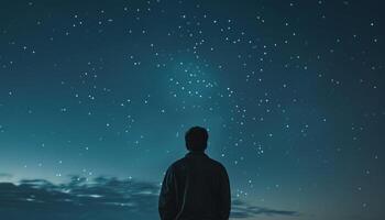 ai generado solitario hombre mirando a el noche cielo foto