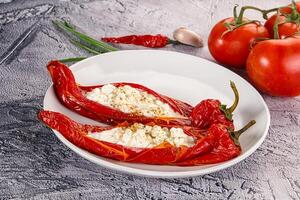 Baked red sweet ramiro pepper with curd photo