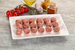 Uncooked raw beef meatball minced photo