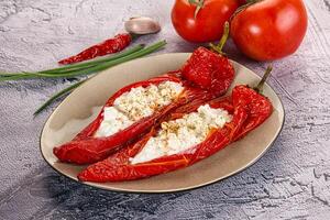 Baked red sweet ramiro pepper with curd photo