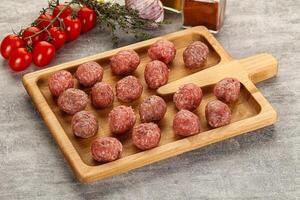 Uncooked raw beef meatball minced photo