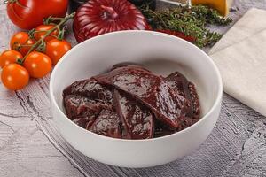Raw beef liver slices for cooking photo