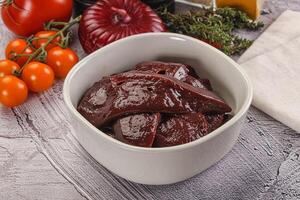 Raw beef liver slices for cooking photo