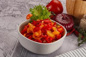 Diced raw bell red and yellow pepper photo