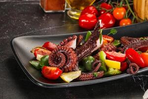 Salad with octopus tentacle and vegetables photo