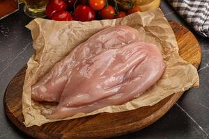 Raw chicken breast fillet for cooking photo