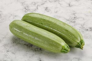 Raw green ripe zucchini vegetable photo