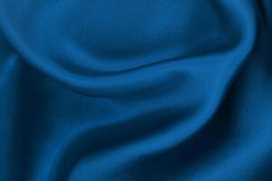 Sumptuous Indigo Fabric, Luxurious Texture for Creative Backgrounds and Artwork, Evoking Silk or Linen Elegance. photo