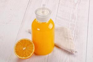 Sweet fresh orange juice in the glass photo