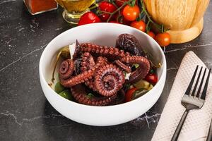 Salad with octopus tentacle and vegetables photo