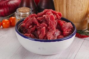 Raw beef meat - sliced strips photo