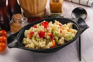 Vegan cuisine couscous with vegetables photo