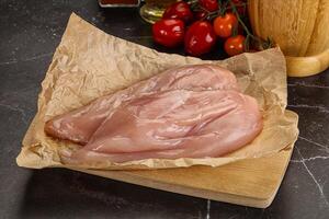 Raw chicken breast fillet for cooking photo