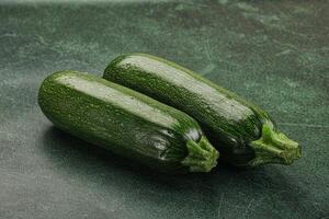 Raw green ripe zucchini vegetable photo