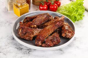 Roasted duck wings with sauce photo