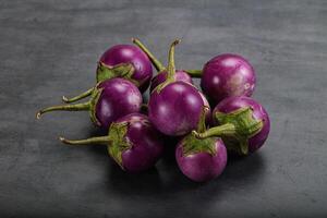 Raw small purple asian baby eggplant photo