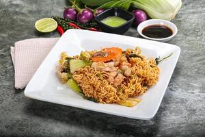 Asian cuisine - Fried noodles with seafood photo